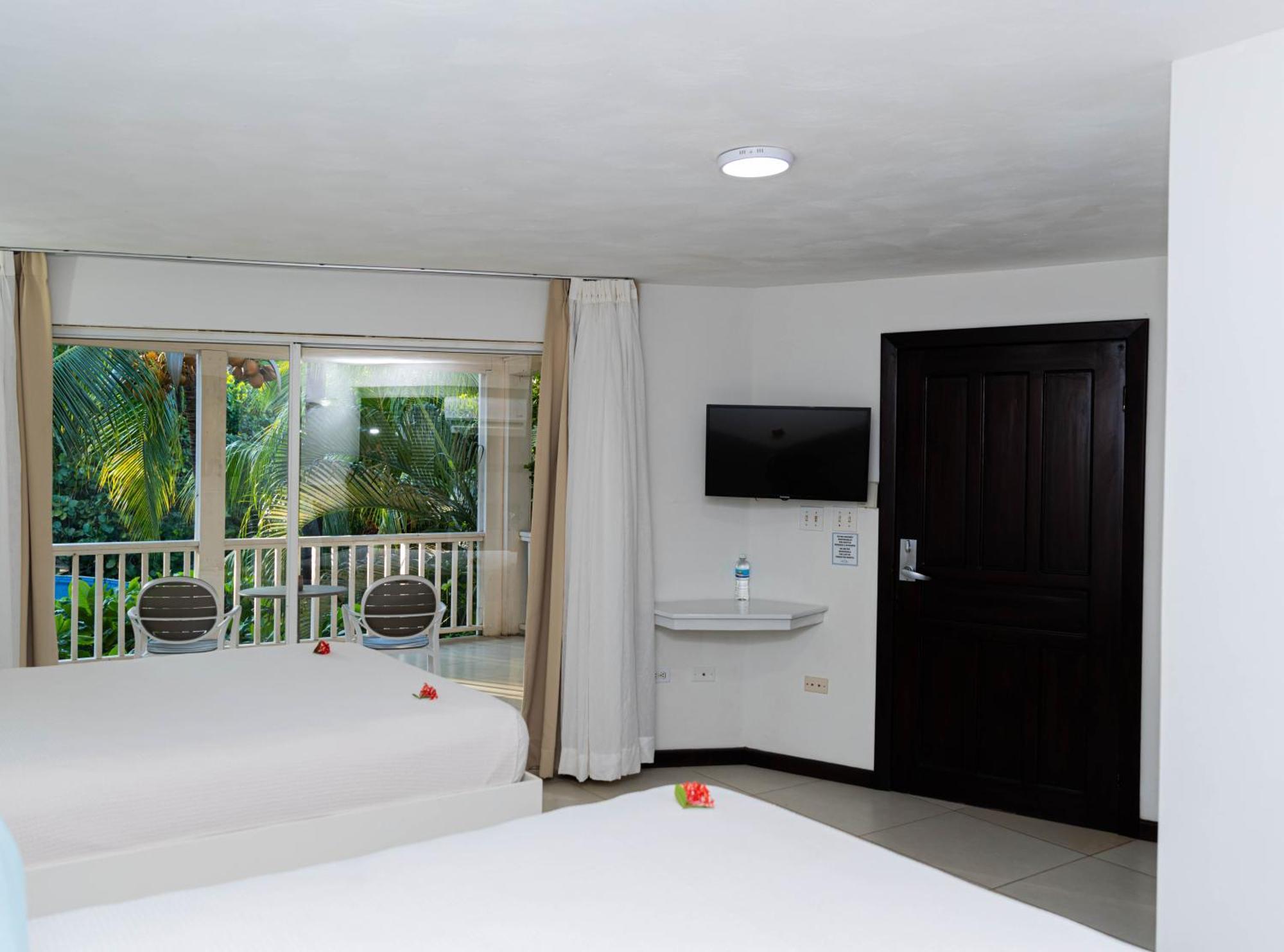 Paradise Beach Hotel & Resort West Bay Pokoj fotografie